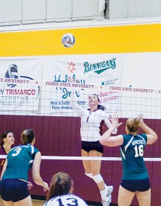 <span class='credit'>Photo By: Kristyn Sonnenberg | Photo Editor</span><span class='description'>Senior Katie Edwards jumps up for the spike at the game against Wayne State last Friday, Sept 11. Ferris beat Wayne State 3 to 2. </span>