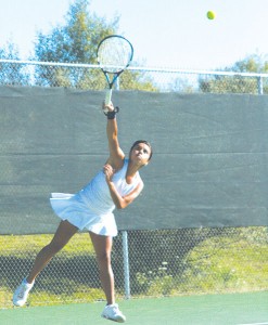 <span class='credit'>Photo By: Kate Dupon | Photographer</span><span class='description'>Senoir Daniel Dimas practicing her swing. Dimas moved to Big Rapids from Mexico City and has persevered through the language and cultural barriers along with a back injury that kept her from playing tennis for a majority of last season.</span>