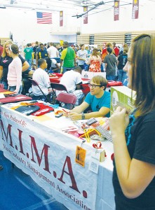 <span class='credit'>Torch File Photo</span><span class='description'>Students checking out RSOs at last year’s Bulldog Bonanza. Pictured here is Matt Bullock, 08-09 President of the Music Industry Management Association manning the booth and providing information for interested students.</span>