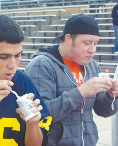 Matt Preston and contest winner Jake Larry work their way through the mass of yogurt put before them at this weekend’s ZTA yogurt eating contest to benefit breast cancer education and awareness. Photo By: Sam Lehnert | Ad Layout Assistant