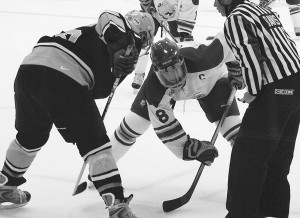 <span class='credit'>Photo By: Kristyn Sonnenberg | Photo Editor</span><span class='description'>Face-off: Senior Cody Chupp (#8) puts his best foot forward in a face-off against a Wilfred Laurier opponent. The team is going into their third official game this Friday against Connecticut.</span>