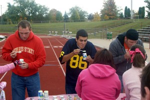 Joel Lawwell (left) eyes up his next cup. Photo By: Sam Lehnert | Ad Layout Assistant