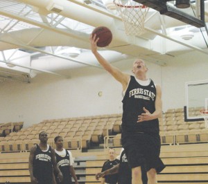 Reach for the Sky: Senior Austin Randel polishes up his slam dunk style at practice. The season opening game took place this Sunday in Illinois, ending with a close 65-60 loss to the Lewis Flyers.  Photo By: Kate Dupon | Photographer