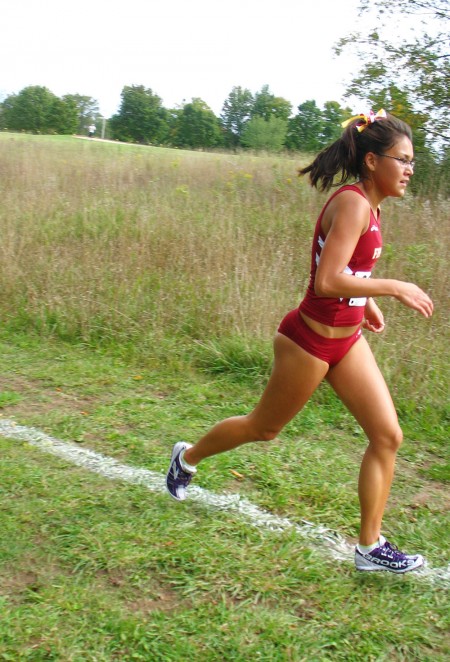 Just Keep Running: Felicia Peacock and the rest of the cross country team participated in the Ray Helsing Bulldog CC Invitational on Sept. 17. The event allowed both college and high school teams to run. Photo By: Angie Walukonis | Photographer