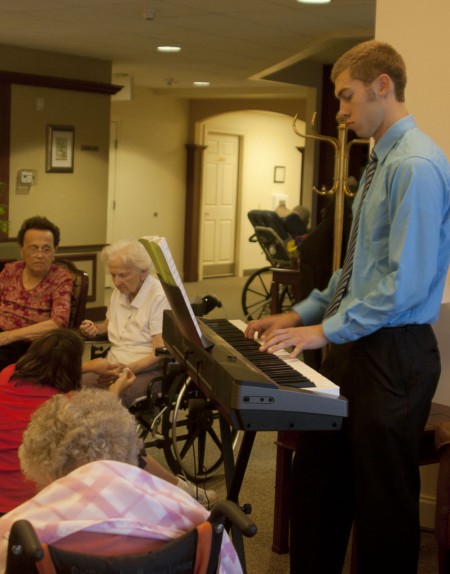 Music to Elderly Ears: Ferris State student Jordan Scott has been playing piano for elderly Big Rapids citizens. Jordan performs a large range of music selections at several assisted living facilities. Photo By: Kate Dupon | Photo Editor