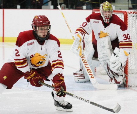 Victory at Home: Freshman Defenseman Scott Czarnowczan helps goalie Pat Nagle defend the net during the St. Lawrence game this weekend. The Bulldogs swept the home-opening series, bringing their 2010-11 record to 3-1. Photo By: Brock Copus | Photographer