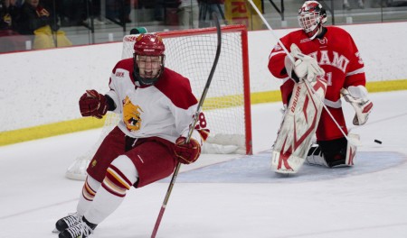 Sending Miami Home: Sophomore forward Kyle Bonis, below, lines up a shot and celebrates a goal against the No. 1 nationally-ranked Miami (Ohio) RedHawks, above. Ferris State defeated Miami Friday and Saturday games. The Bulldog victories improve the Bulldogs’ 2010-11 season record to 5-3-2 overall and 2-2-2-2 in conference play. Photos By: Brock Copus | Photographer