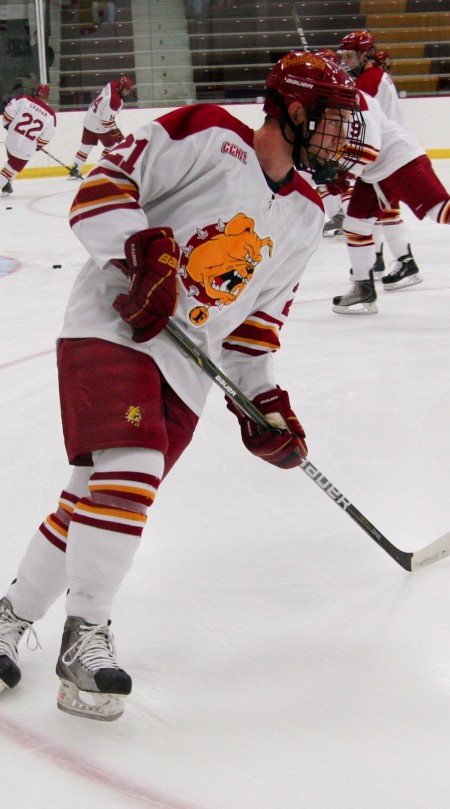 Becoming a Threat: Senior Nate Hennig warms up before Friday’s game against Michigan. Hennig has scored four goals in the first eight games of the 2010-11 season, becoming an offensive threat. Photo By: Brock Copus | Photographer