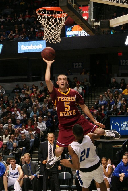 Career High: Matt DeHart leaps over a Laker defender to add another bucket to his 21 points, a career high, in the 131 Showdown game. Photo By: Brock Copus | Photographer