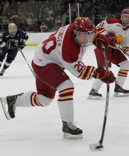 Defeating the Buckeyes: Sophomore forward Matthew Kirzinger lines up a shot during the Feb. 18 game against Notre Dame. The Bulldogs defeated the Buckeyes 3-1 on Feb. 25. The Bulldogs and the Buckeyes battled to a 2-2 tie in the first game of the series, with the Bulldogs winning the shootout 1-0.  Photo By: Brock Copus | Photographer