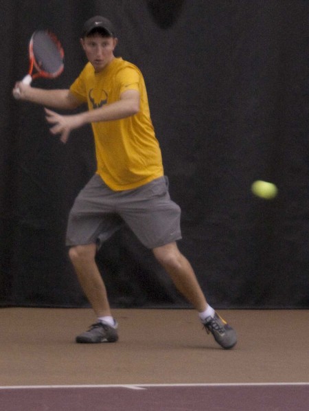 Men’s Tennis: Junior Evan Wharton lines up for a shot during a Bulldog practice. The men’s tennis team will play Chicago University on March 8 in Chicago. Photo By: Kate Dupon | Photo Editor