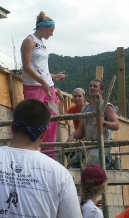 Giving Back: Ashley Huntey, a junior on the Ferris State volleyball team, helps cement a building during mission trip with Caribbean Christian Centre for the Deaf over spring break. Photo Courtesy of Ashley Huntey