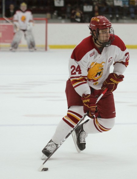 Award Finalists: Bulldog seniors Zach Redmond and Pat Nagle compete during a 2010-11 game. Both Redmond and Nagle were recognized as CCHA award finalists. Torch File Photo