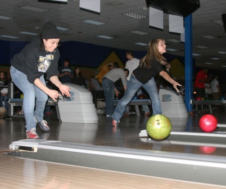 Bowling for Kids: Nicole Allen, left, and Samantha Evans, right, bowl during the Big Brother Big Sisters “Bowl for Kids’ Sake” at the Gate. The event was a fundraising opportunity that took place on March 22-23 and raised $6,000. Photo By: Kate Dupon | Photo Editor