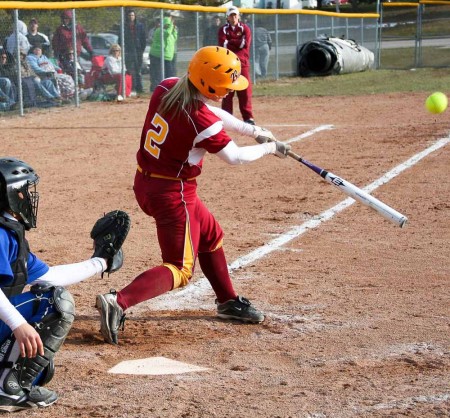 Bulldog Softball: Junior third baseman Makenzi Peterson, above, takes a swing during the April 8 game against Lake Superior State. Senior Lynsay Weaver, below, slides into home during the Bulldogs’ 4-0 victory over the Lakers. Photos By: Brock Copus | Photographer