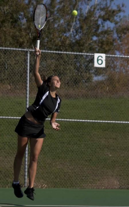 Winning Season: Natalie Diorio, junior serves during the women’s tennis season. The women’s tennis team played Southern Indiana on April 9 and won 9-0 bringing the season to 19-4 overall. Torch File Photo