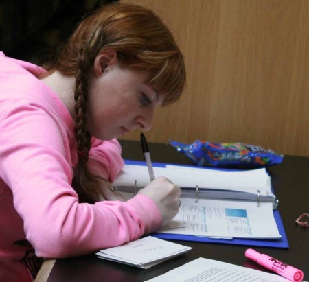 Library Reading: Sara Bostwick reads her notes in the FLITE Library. Reading whether it's for school or leisure helps expand knowledge and the imagination. Photo By: Kate Dupon | Photo Editor