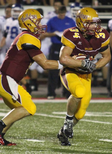 Stopping Tiffin: FSU junior running back Skyler Stoker gets handed the ball during a game earlier this season. The Bulldogs defeated Tiffin on Sept. 24, bringing the overall 2011 record to 3-1. Torch File Photo