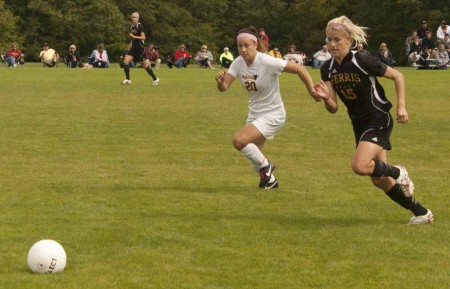 Winning Streak: FSU freshman forward Sam Kay pushes past an opponent during a 2011 game, while Mekyla Spraggins, senior defender, offers support. The Bulldogs are on a three-game winning streak following their victories against Ashland on Sept. 23 and Lake Erie on Sept. 25. Photo By: Kate Dupon | Photo Editor