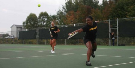 Defeating Tech: FSU junior Tabitha Simpson returns a ball during the Michigan Tech match on Sept. 25 as her senior partner Natalie Diorio watches. The Bulldogs defeated Michigan Tech 7-2 overall. Photo By: Kate Dupon | Photo Editor