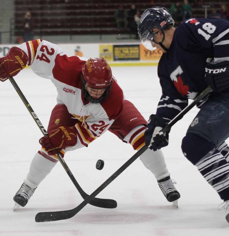 Swept Series: Freshman center Dom Panetta attempts to win a face off against Toronto. The Bulldogs swept the series against St. Lawrence the weekend of Oct. 7-8 to start the season undefeated. Photo By: Brock Copus | Multimedia Editor 