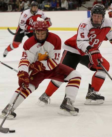 Winning Streak: FSU sophomore right wing Justin DeMartino skates past a RPI defensemen during the Oct. 15 game. The Bulldogs are off to an undefeated start to the 2011-12 season. Photo By: Brock Copus | Multimedia Editor