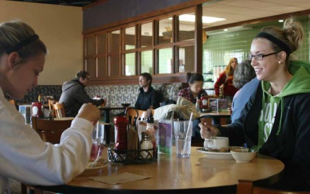 Overcrowded Rock: Kristi Bridges and Alyssa Stafford enjoy their meal at the Rock Cafe before the lunch rush hits. The Rock is becoming overcrowded causing many students to begin protesting the Rock and petitioning to reopen Center Ice. Photo By: Kate Dupon | Photo Editor