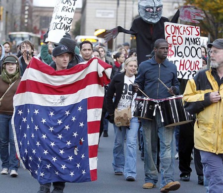 Against the Man: Protestors march during Occupy Wall Street, a movement that involves people from all over the country who are tired of greed and corporaption. Ferris students hold mixed feelings about the movement that is now spreading to college campuses as well. Photo Courtesy by MCT