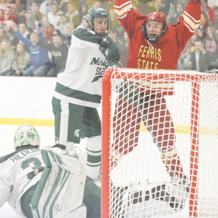 I’ll Huff and I’ll Puff and Score: Ferris State junior right wing Andy Huff celebrates the fourth goal of the game against Michigan State. The Bulldogs swept the Spartans for a home-and-home series. Photo By: Brock Copus | Multimedia Editor