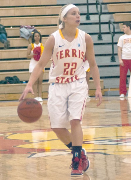 Playmaker: Ferris State junior guard Sarah DeShone dribbles the ball and calls a play to her teammates. The Bulldogs would be unable to make up the ground that Grand Valley State gained early on and would fall at home 83-73. Photo By: Tori Thomas | Photographer