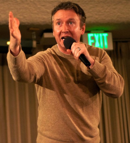 Chad Daniels: Comedian Chad Daniels gestures toward the crowd in the Rankin Center Dome Room. His comedy routine about parenting was well-recieved by the student audience. Photo By: Tori Thomas | Photographer