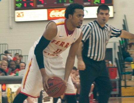 Planning a Move: Ferris guard Kenny Brown holds the ball against Saginaw Valley State. Brown made 17 points in the Bulldogs’ final home game loss against the Cardinals, 75-67. Photo By: Tori Thomas | Photographer