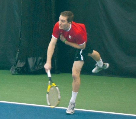 Sending it In: Junior Aaron Dial serves in a doubles match against Ohio Dominican with Otto Keresztes. The duo fell 8-2 but would win the next day against Findlay.  Photo By: Tori Thomas | Photographer