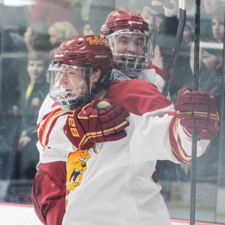 State of Elation: Ferris State captain Kyle Bonis screams in excitement while Simon Denis hops on his back after scoring the game-tying goal with less than a minute remaining in regulation.  Photo by Brock Copus | Multimedia Editor