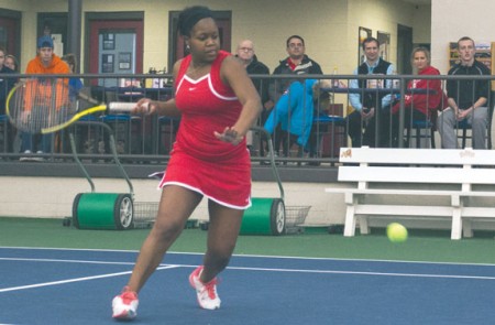 Sending It Back: Lady Bulldog senior Tabitha Simpson returns the ball to a Hope College player. Ferris would perform a comeback victory over the Flying Dutch 5-4. Photo By: Eric Trandel | Photographer