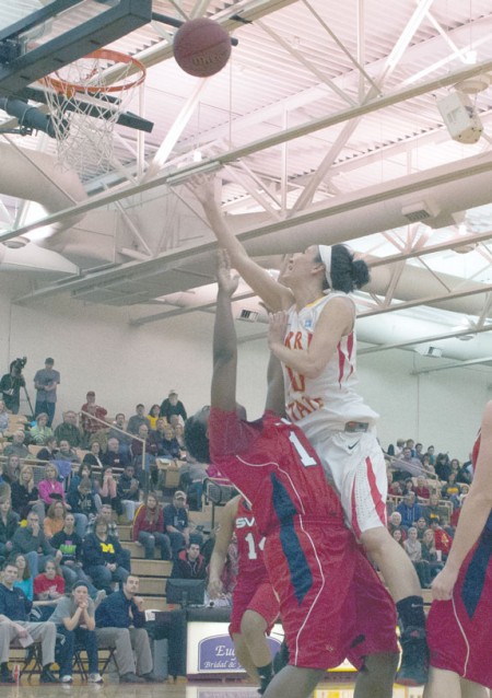 Up and Over: Senior guard Kylie Muntz floats the ball over the top of a Saginaw Valley State defender at the final home game of the season. The Lady Bulldogs’ season concluded against Wayne State with a 68-59 loss. Photo By: Eric Trandel | Photographer