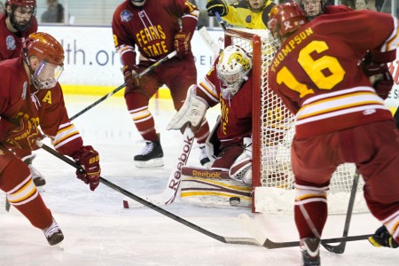 Hold the Line: Bulldog sophomore goaltender C.J. Motte keeps the puck in play against a Michigan wraparound attempt. Moote had 35 saves on the night Photo by  Brock Copus | Multimedia Editor