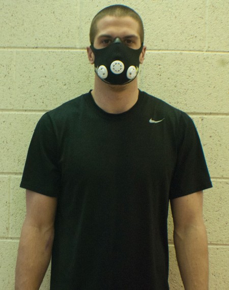 Masking It: Elevation masks were donated to the Ferris football team to help improve lung stamina. Shown above on sophomore quarterback Taylor Masiewicz, the mask covers the nose and mouth to reduce the level of oxygen intake.  Photo By: Tori Thomas | Photographer