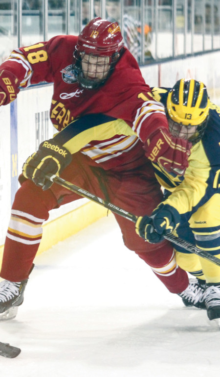 Andy Huff battles through Michigan defense during the 2012-13 season. This year’s season will begin on Oct. 5 against Colgate. Torch File Photo