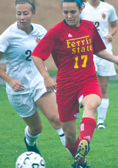 Sophomore forward Nicole Boehnke sneaks in for a steal attempt. The women hope for a win against Tiffin on Oct. 18. Torch File Photo