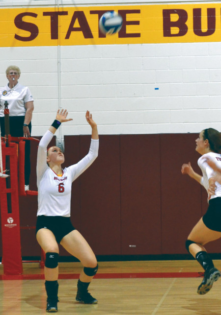 Freshman setter Stephanie Sikorski, setting up the ball for her teammate, has proven herself time and again as a key team player throughout the season as the starting setter for the women’s volleyball team.  Torch File Photo