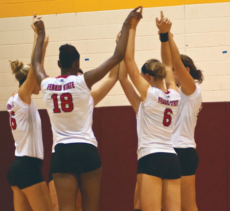 Angi Kent (18) huddles with her teammates during the Bulldog Invitational. The women’s volleyball team will face Tiffin and Ohio Dominican during homecoming weekend. Torch File Photo