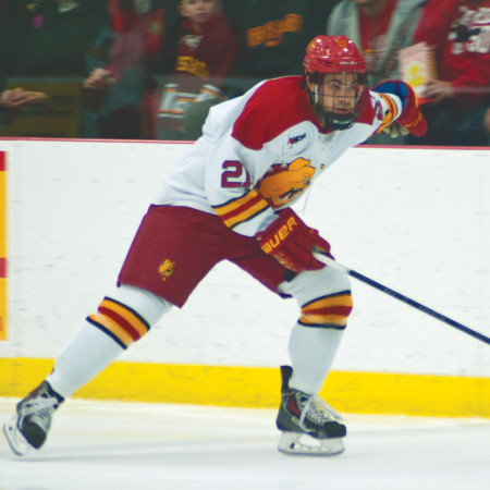 Junior forward Justin Buzzeo skates down the ice in the series against Bowling Green. Justin has been working hard to play a bigger role on the team, becoming the leading goal scorer this season. Photo By: Tori Thomas | Photographer