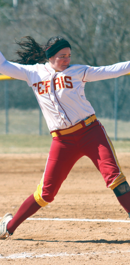 Senior pitcher Amy Dunleavy winds up a pitch during the 2012-13 season. The softball team lost seven players to graduation last year and looks to the upcoming season with high hopes with a new team of young talented players. Torch File Photo 