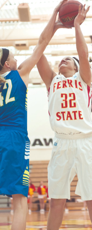 Junior Heidi Highstreet shoots over a Lake Superior State defender in a winning game on Jan. 25. The women’s team now prepares to face Michigan Tech on Feb. 6. Photo By: Tori Thomas | Photographer