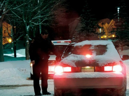  A Ferris DPS officer stops cars from entering Finch Court where the suspect from the February 1 Ferris shooting, that happened at the Venlo apartments, was hiding. All four police agencies were on hand during the event.