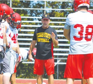 Head coach Tony Annese walks team through one of many pre-season practices as Ferris State prepares for upcoming 2014 football season.