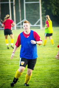 Junior goaltender Maddie Haustein jogs through an early morning soccer practice.