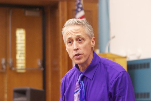 Thomas Haller speaks animatedly during “Partent University” at Crossroads Charter Academy.