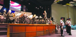 Guest conductor, University President David Eisler, conducts the band for “Suosas March” with the Color Guard on watch. This is the 12th annual Veteran’s Day Concert.